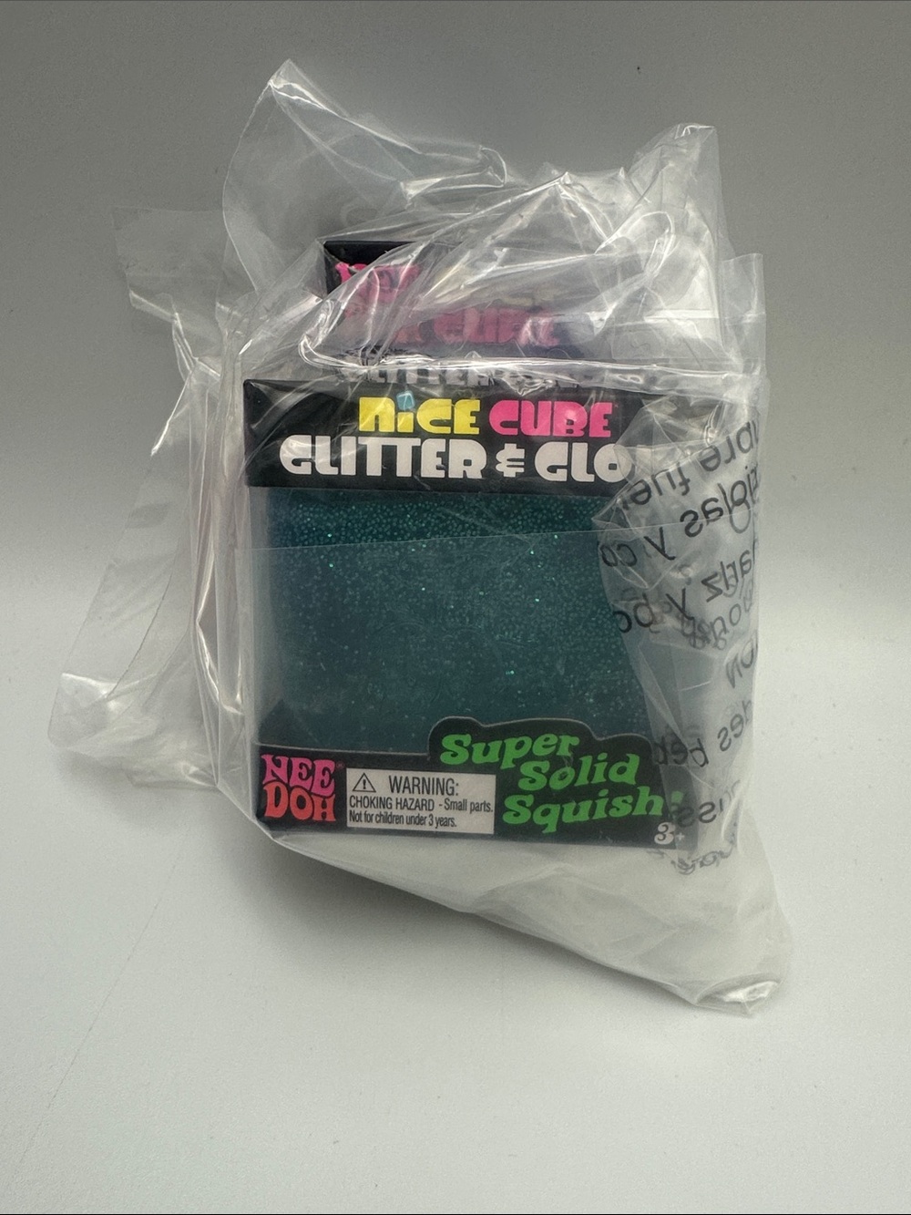 Icee Cube Glitter & Glow Super Solid Squish - needoh with plastic protection